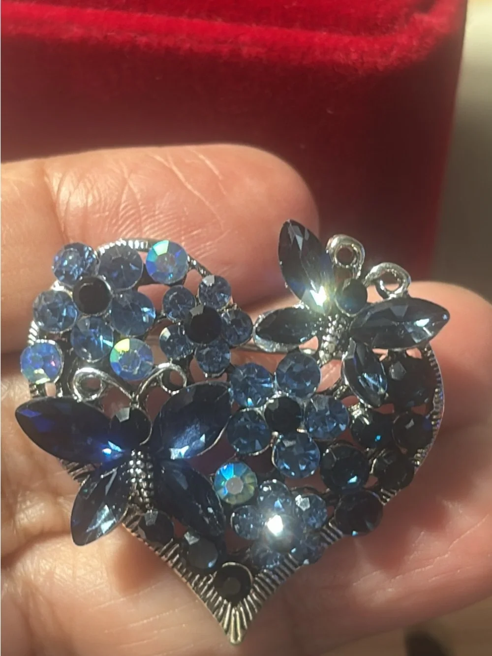 Heart-Shaped Blue Crystal Brooch with Floral and Butterfly Motifs